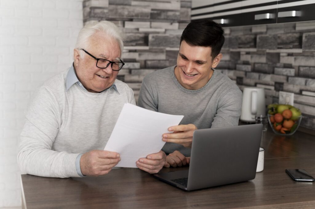 An older man discussing with a young man