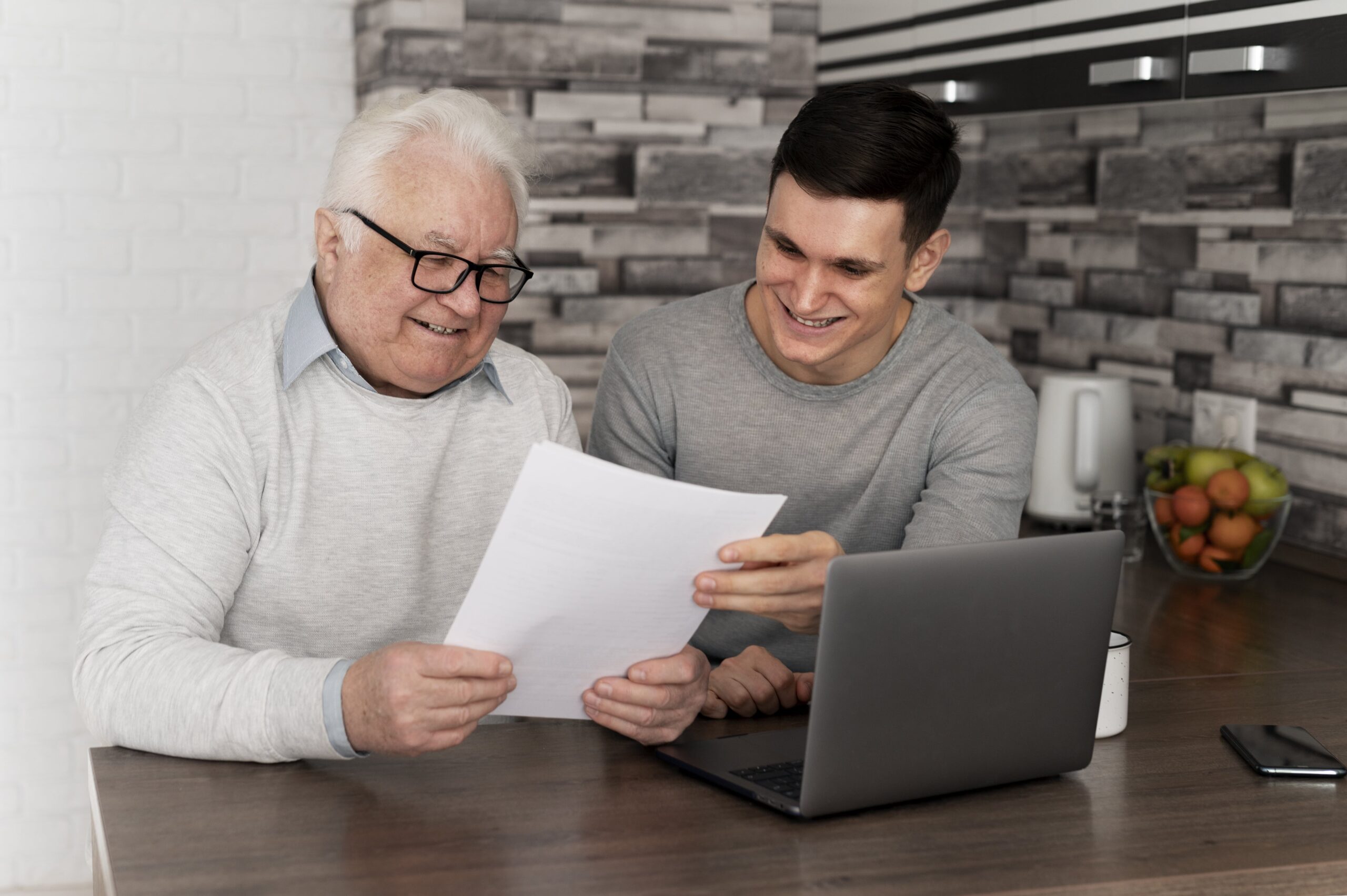 An older man discussing with a young man